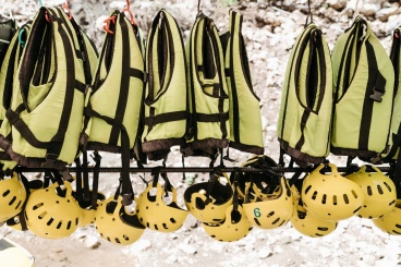 Safety vests and hard hats prepared for a construction project